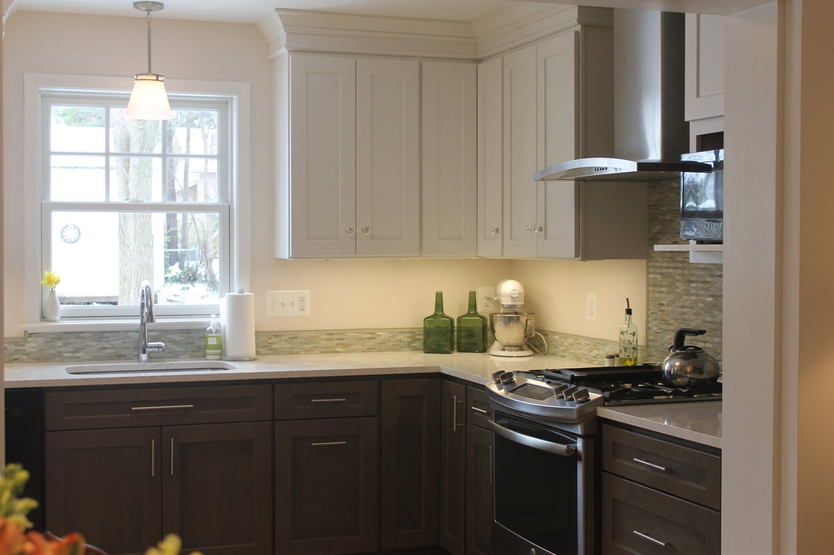 Kitchen renovation featuring neutral tones and a sleek stainless steel range, completed in Annapolis, MD by Villa Builders