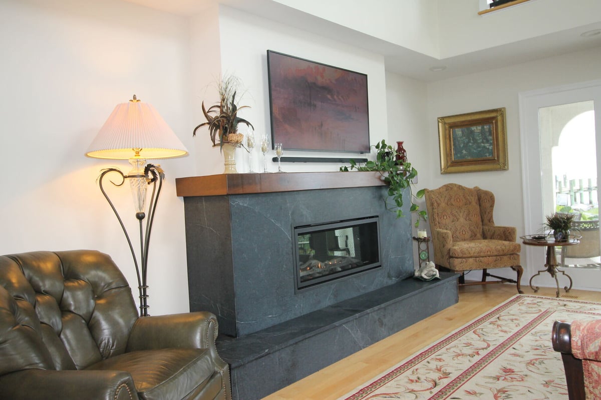 Remodeled living space featuring a sleek fireplace and elegant decor, designed by Villa Builders in Annapolis, MD