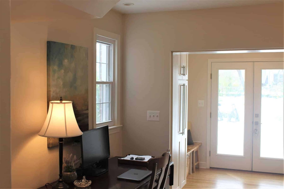 Home office area with desk and lamp by Villa Builders in Annapolis, Maryland